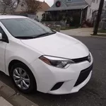 Toyota Corolla,  2014 модель белого цвета..